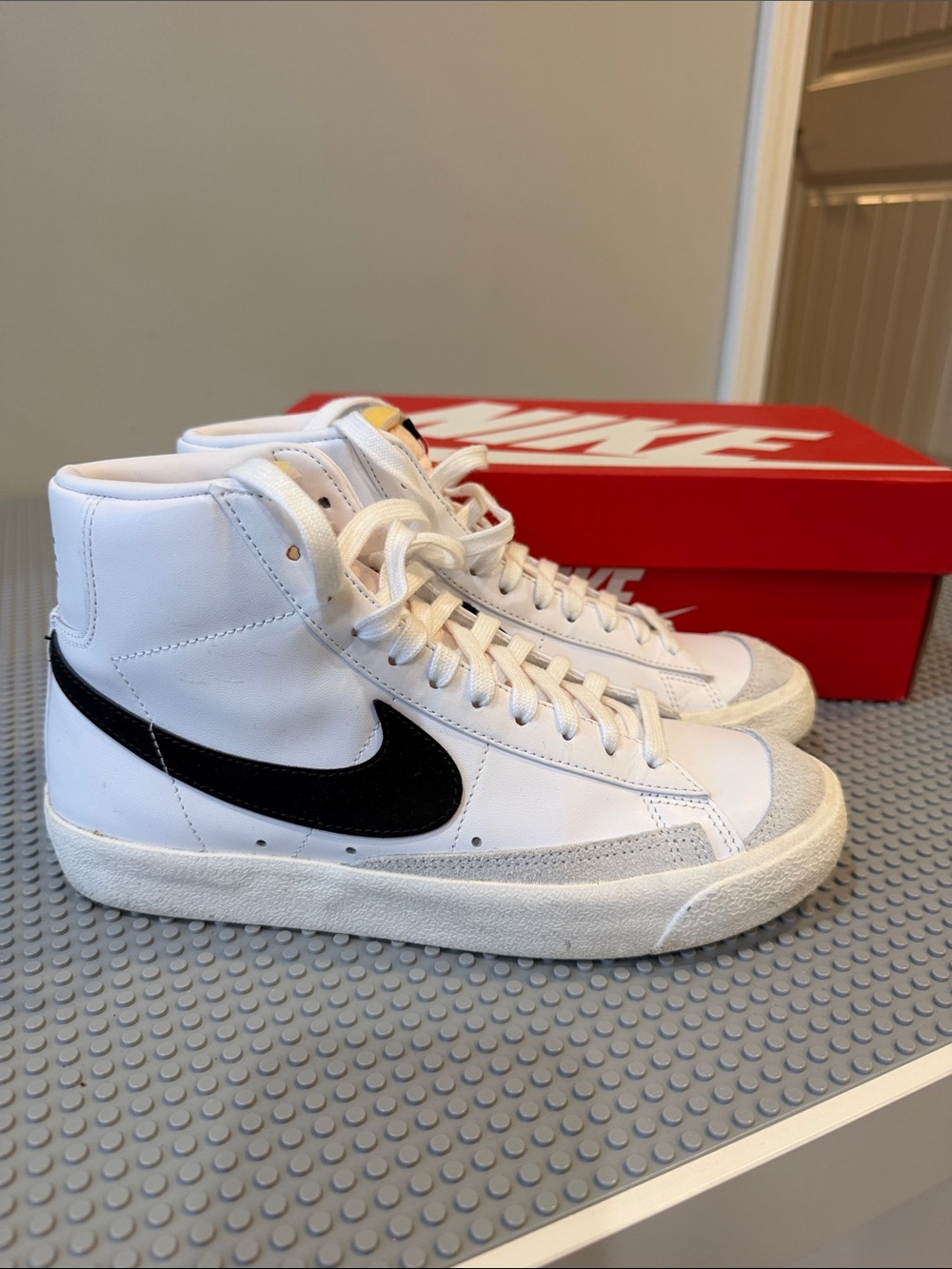 Nike White High-Top Sneakers with Black Swoosh